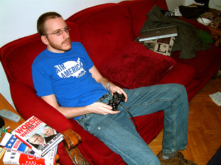Boston resident Tom Kenyon relaxes in his apartment as Bush's motorcade passes through Washington, D.C.